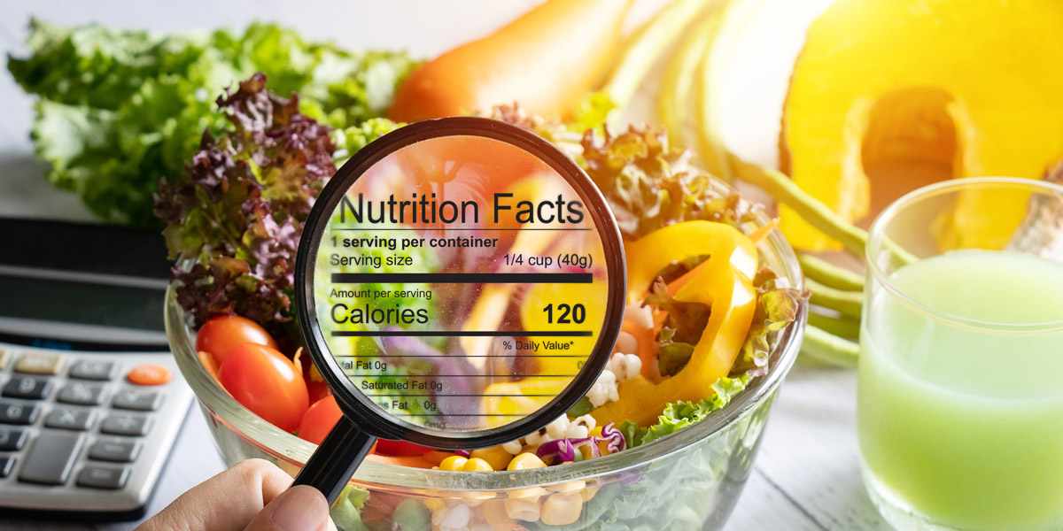 Magnifying-glass-zooming-in-on-salad-bowl-to-see-nutritional-information
